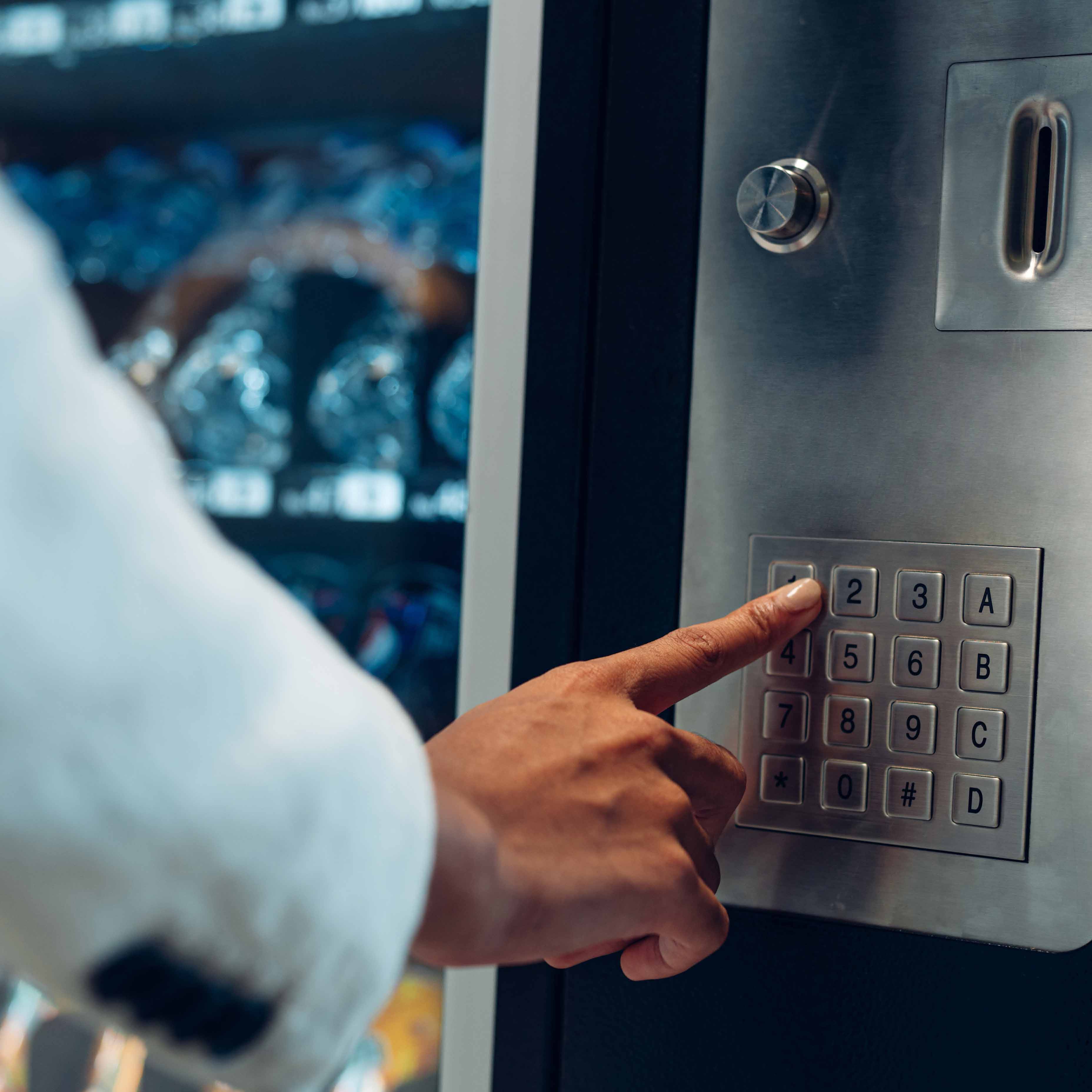 A person is selecting an item to buy from a vending machine.