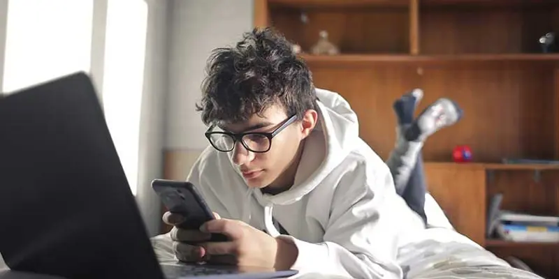 Teenager looking at mobile phone