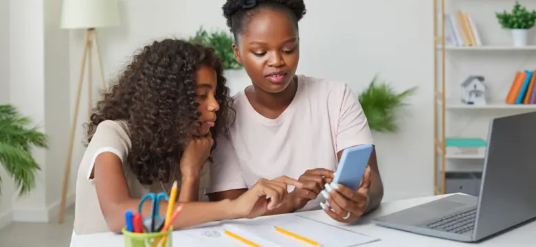 Woman and child looking at a phone